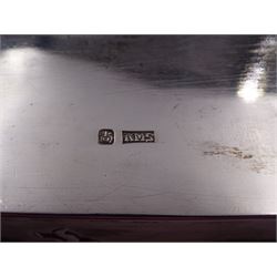 Late 19th century/early 20th century Chinese export silver mounted cigarette box, of rectangular form, decorated in relief with dragons, the hinged cover with similar dragon decoration and central blank oval cartouche, opening to reveal a softwood lined compartmentalised interior, stamped beneath with character mark and KMS for maker Kwong Man Shing, H6.3cm, W15.5cm, D9.5cm