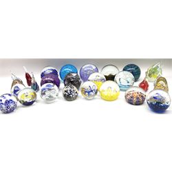 Collection of glass paperweights, to include an example marked Selkirk Glass Scotland beneath, six modelled as fish, and others of spherical or pear form with various internal decoration including controlled bubbles, canes, flowers, etc. 