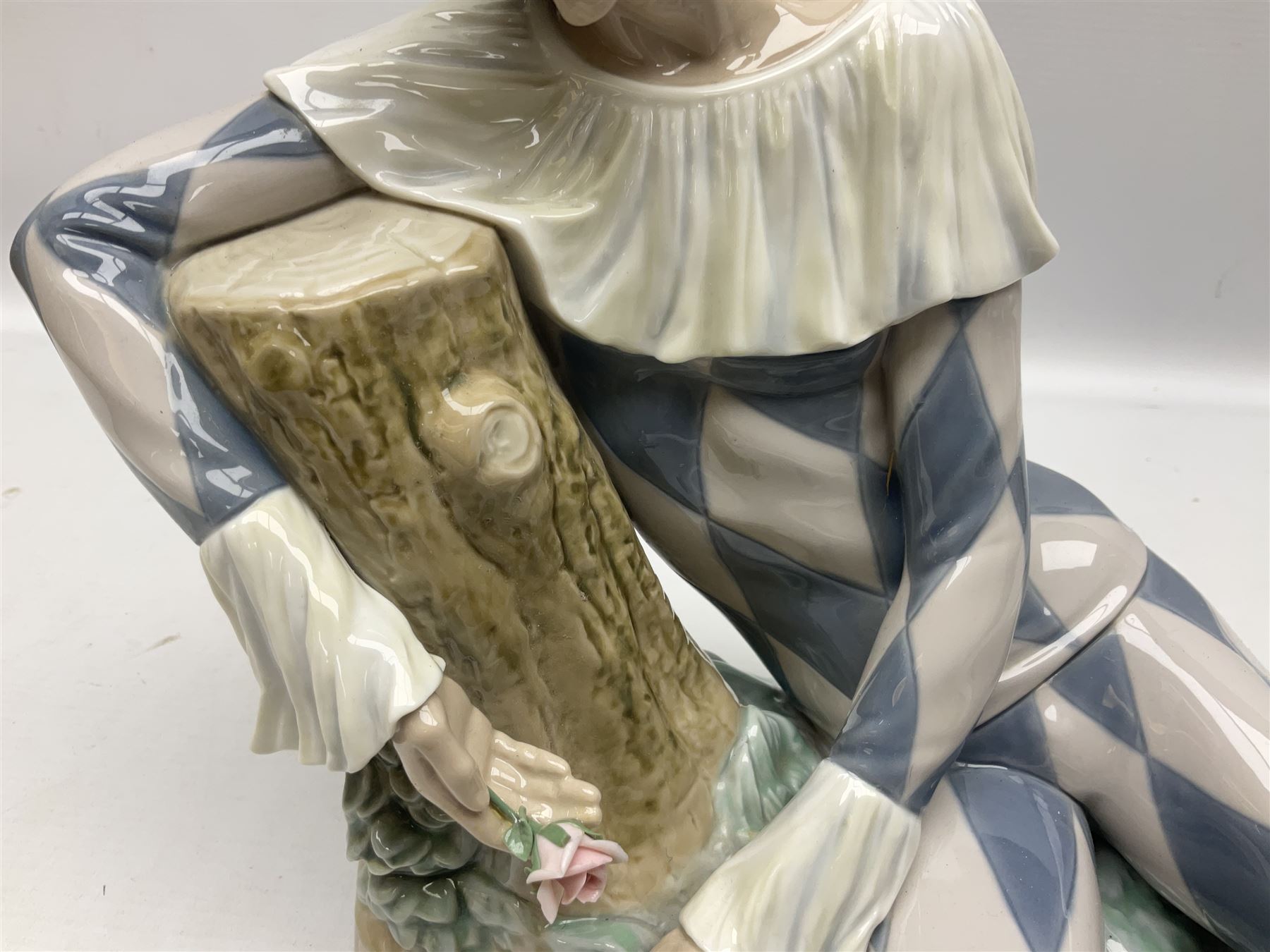 Lladro figure, Harlequin Reclining, modelled as a recumbent harlequin, no 5128, Sculpted by Salvador Furio, year issued 1982, year retired 1987, H28cm 