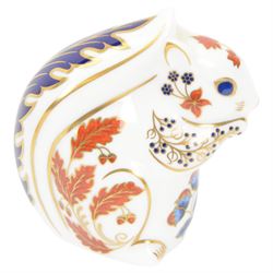 Four Royal Crown Derby paperweights, comprising Puffin, Squirrel, Badger, and Tiger Cub, each with silver stoppers