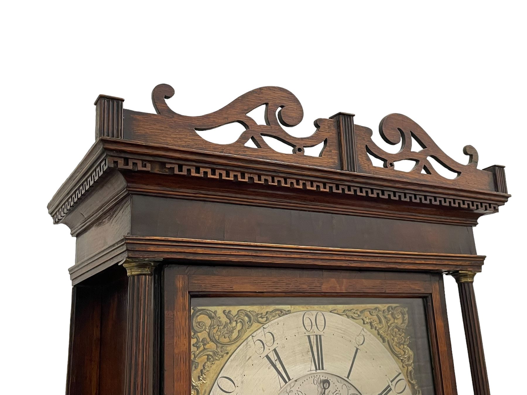 William Watson of  Blackburn (Lancs)  - late 18th century 8-day oak and mahogany cross banded longcase clock, with a flat top and open fretwork above, deep cornice with dogtooth moulding and frieze beneath, square hood door flanked by reeded pilasters with brass capitals, trunk with  reeded quarter columns, long trunk door with concave corners on a plinth with canted corners on bracket feet, brass dial with cast brass spandrels, broad silvered chapter ring with Roman numerals and five-minute Arabic's, a profusely engraved and silvered dial centre with seconds dial, matching steel hands and calendar aperture, hourly rack striking movement with a recoil anchor escapement. With weights, pendulum and key. 
William Watson of Northgate, Blackburn, is recorded as working c1770-1814 . As with this clock Watson frequently signed some of his clocks without a placename.