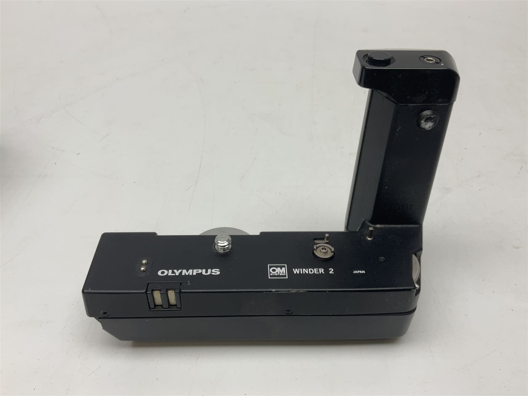 Olympus OM-1 camera body, serial no 913212, with 'Olympus OM-System F.Zuiko Auto-S 1:1.8 f=50mm' lens, serial no.74374, 'Vivitar wide angle MC 28mm 1:2.8 49mm' lens, serial no. 42042268, and Olympus OM winder 2