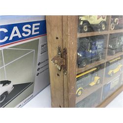 Franklin Mint 'The Classic Cars of the Fifties' collection with display rack, eleven (ex.12) die-cast models and folder of paperwork; another wall mounting display cabinet containing fifteen die-cast models; and an unused boxed Master Tools model display case