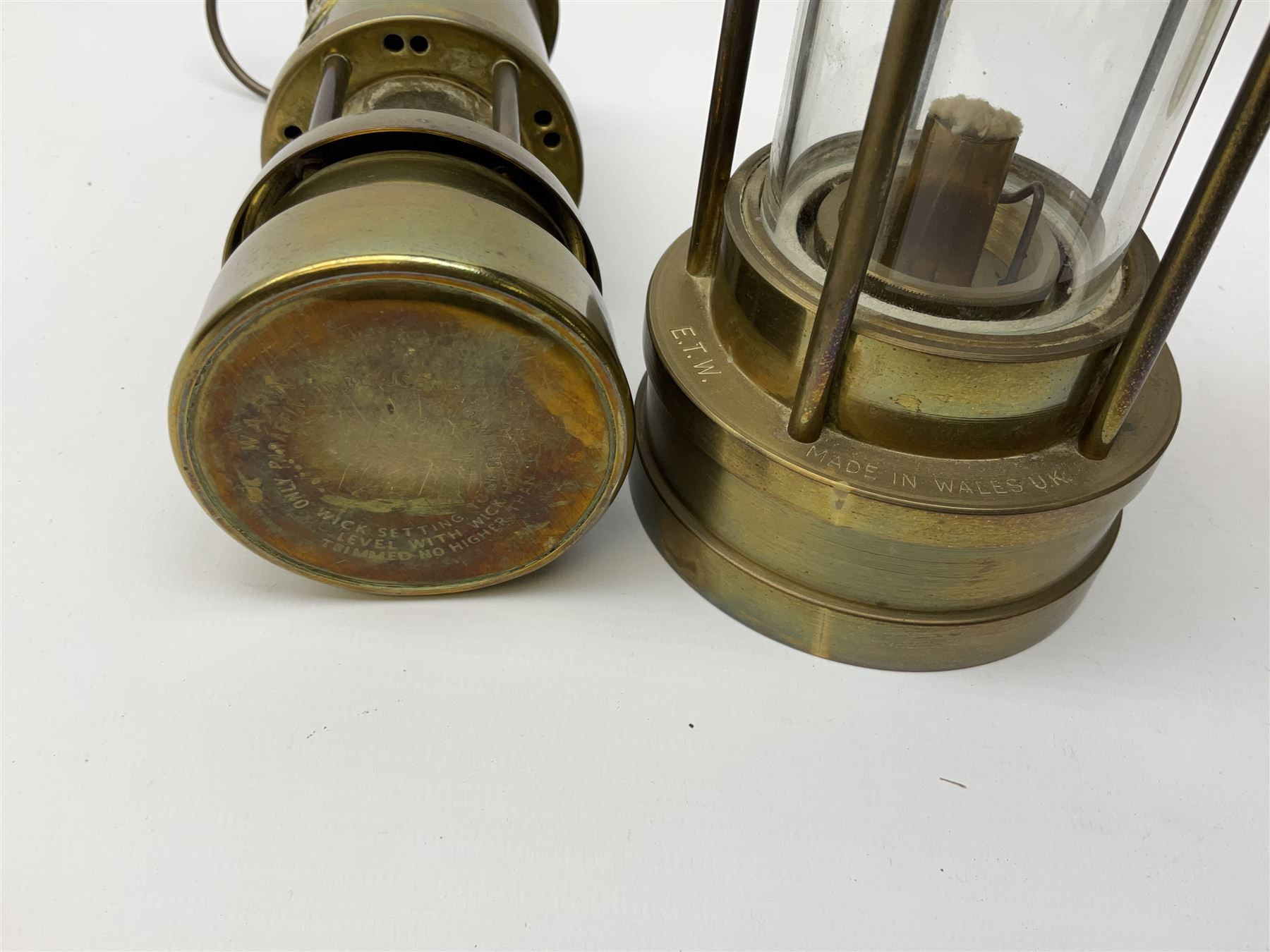 A collection of five mining lamps, to include examples by F Thomas & William Ltd, H25.5cm, Ferndale Coal, 18cm, and Daidler Durham, H21cm, plus two unmarked examples.