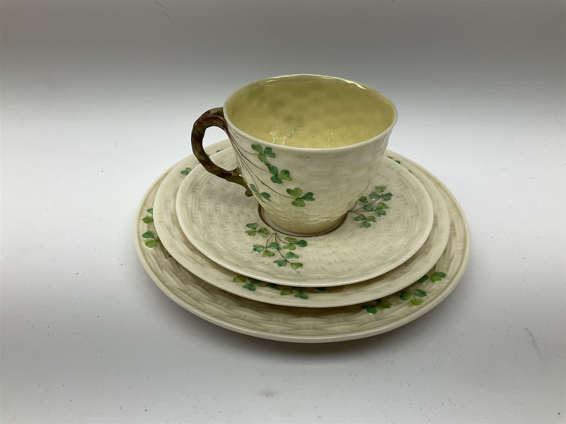 Two Royal Crown Derby pattern Imari soup bowls, pattern 2451, Belleek Fermanagh Ireland four piece set in green shamrock pattern, Royal Doulton small lady figure, Marie HN1370, large Wedgwood fruit bowl, Sylvac jardiniere in autumn leaves pattern, five pieces Co-operative Society commemorative ceramics, with selection of other ceramics. 