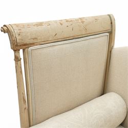 19th Century French day bed, the shaped back and scroll ends with fluted supports and carved rosettes, upholstered in natural linen with loose seat cushions and bolster pillows