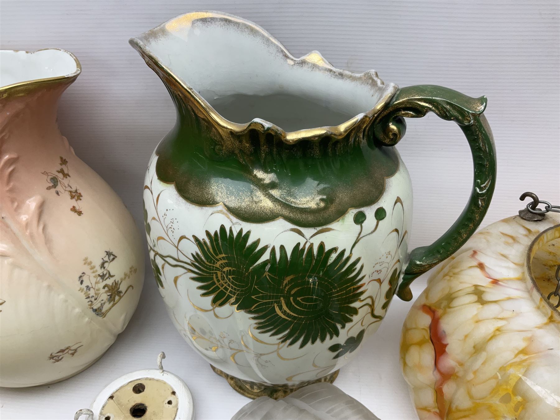 Two Art Deco mottled glass fly catcher ceiling light shades, together with two other 1930s moulded glass ceiling light shades and two Victorian style wash jugs, largest shade D33cm