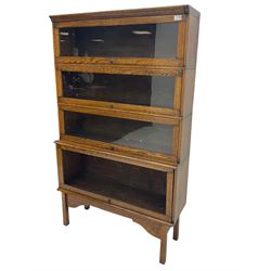 Early 20th century oak stacking library bookcase, in four sections (bottom pane lacking)