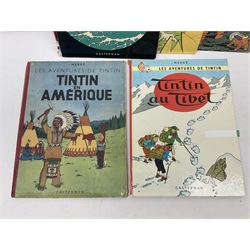 Twenty one first edition Herge, 'The Adventures of Tin Tin' books published by Casterman Bruxelles, with French text and coloured comic strip illustrations throughout; comprising Tintin Au Congo 1946, Tintin En Amerique 1946, Les Cigares du Pharaon 1955, Le Lotus Bleu 1946, L'Oreille Cassee 1943, L'ile Noire 1943, Le Sceptre d O'ttokar 1947, Le Crabe Aux Pinces D'or 1943, L'Etoile Mysterieuse 1942, Le Secret de la Licorne 1943, Le Tresors de Rackan Le Rouge 1945, Les 7 Boules de Cristal 1948, Le Temple du Soleil 1949, Au Pays de L'Or Noir 1950, Objectif Lune 1953, On a Marche sur la Lune 1954, L'Affaire Tournesol 1956, Coke en Stock 1958, Tintin au Tibet 1960, Les Bijous de la Castafiore 1963 and Vol 714 Pour Sydney 1968
