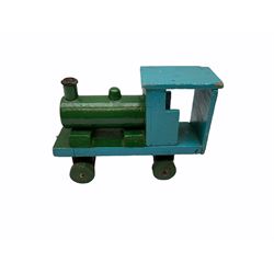 1991 Atlantic Bears limited edition black teddy bear, the revolving head with applied eyes, vertically stitched nose and jointed limbs with growler mechanism No.84/100 H53cm; together with clockwork tin-plate road roller possibly by Mettoy and a push-along painted scratch built wooden locomotive (3)