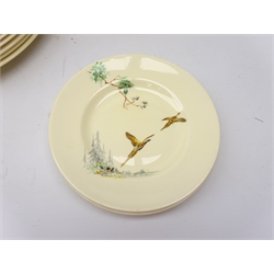  Royal Doulton 'The Coppice' pattern six place dinner service no. D.5803, comprising dinner plates, side plates, tea plates, two tureens, two graduated platters & sauce boat and stand  