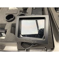Two Nite-Site add-on kits in hard plastic carrying cases; one with charger