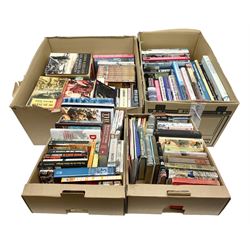 Large collection of hardback and paperback books, mainly military books, to include Band of Brothers, Dawn of D-Day, Dessert Warrior, Book of the Somme, Battle of Britain, etc in four boxes  
