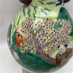 20th century Chinese Famille Rose vase, of baluster form with flared lobed rim and twin figural handles, decorated in polychrome enamel with figures dancing and playing instruments within a garden setting, H42cm