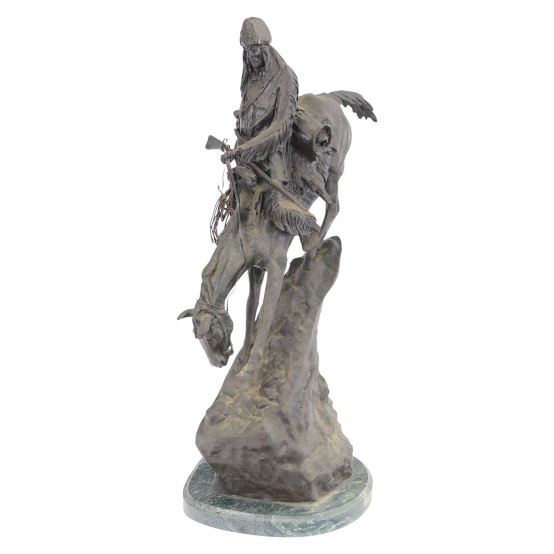 After Frederick Remington; The Mountain Man bronzed spelter figure of a native American trapper upon a marble base with plaque, H72cm