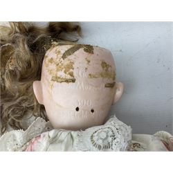 Armand & Marseille bisque head and composition bodied doll, with sleeping eyes and open mouth, the back of the head impressed 390, together with a further later doll 