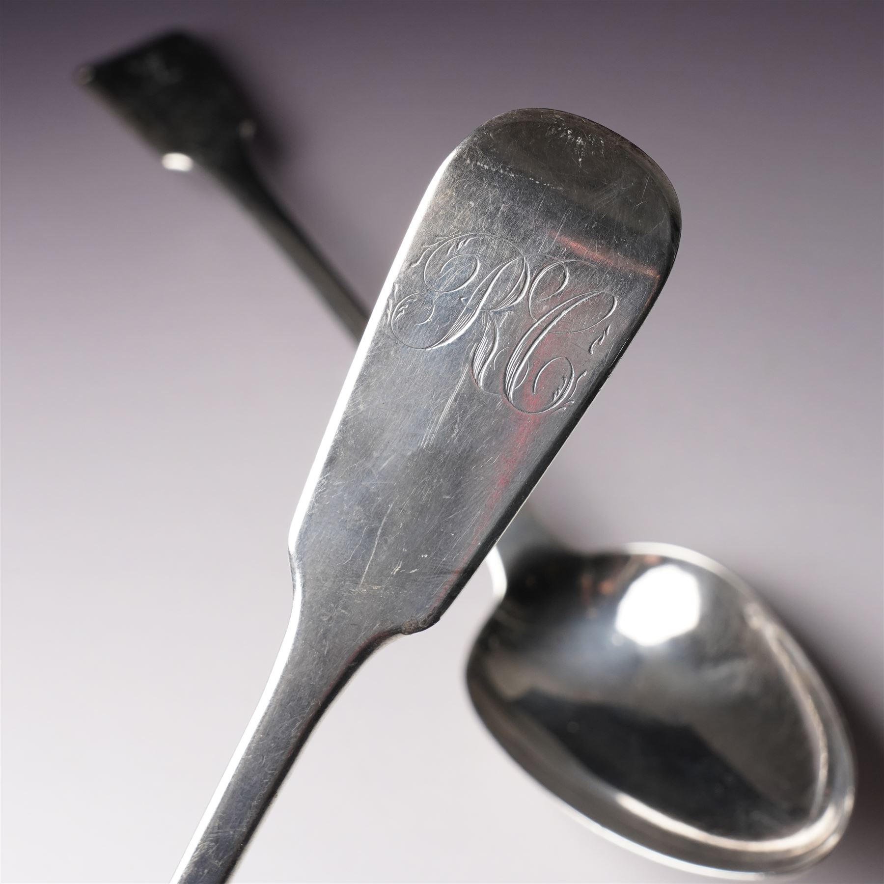  George IV silver fiddle pattern basting spoon engraved with monogram London 1827 Maker Clement Cheese and another London 1823 Maker George Turner (2)