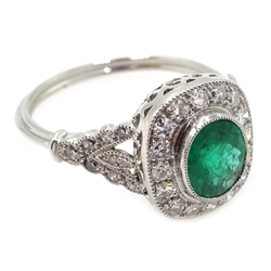  Platinum (tested) oval emerald and diamond ring, with diamond set shoulders  