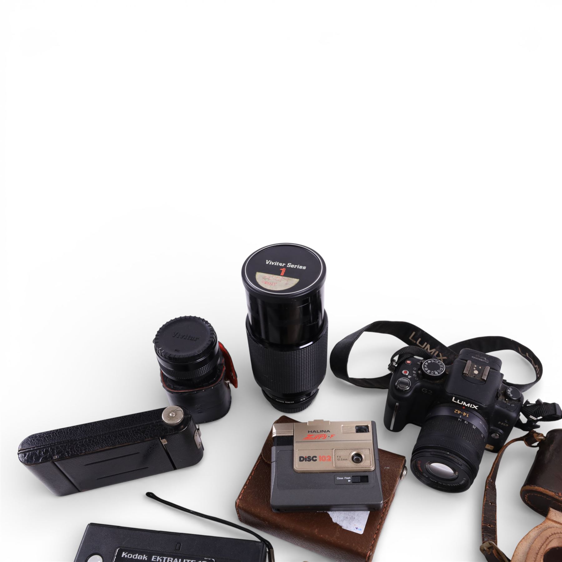 Collection of cameras, lenses and accessories, including Panasonic Lumix DMC-G2, Koroll 24, Coronet folding camera, Halina Zippy F and Vivitar Series 1 lens