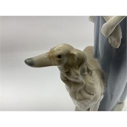 Three Lladro figure groups, comprising Clown no 4618, Lady with Greyhound no 4594 and Playful Piglets no 5228, largest H40cm
