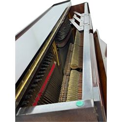 Waddington - Edwardian mahogany upright piano, rectangular top with panelled front, rounded key cover, makers name on fallboard, raised on bracket supports with castors