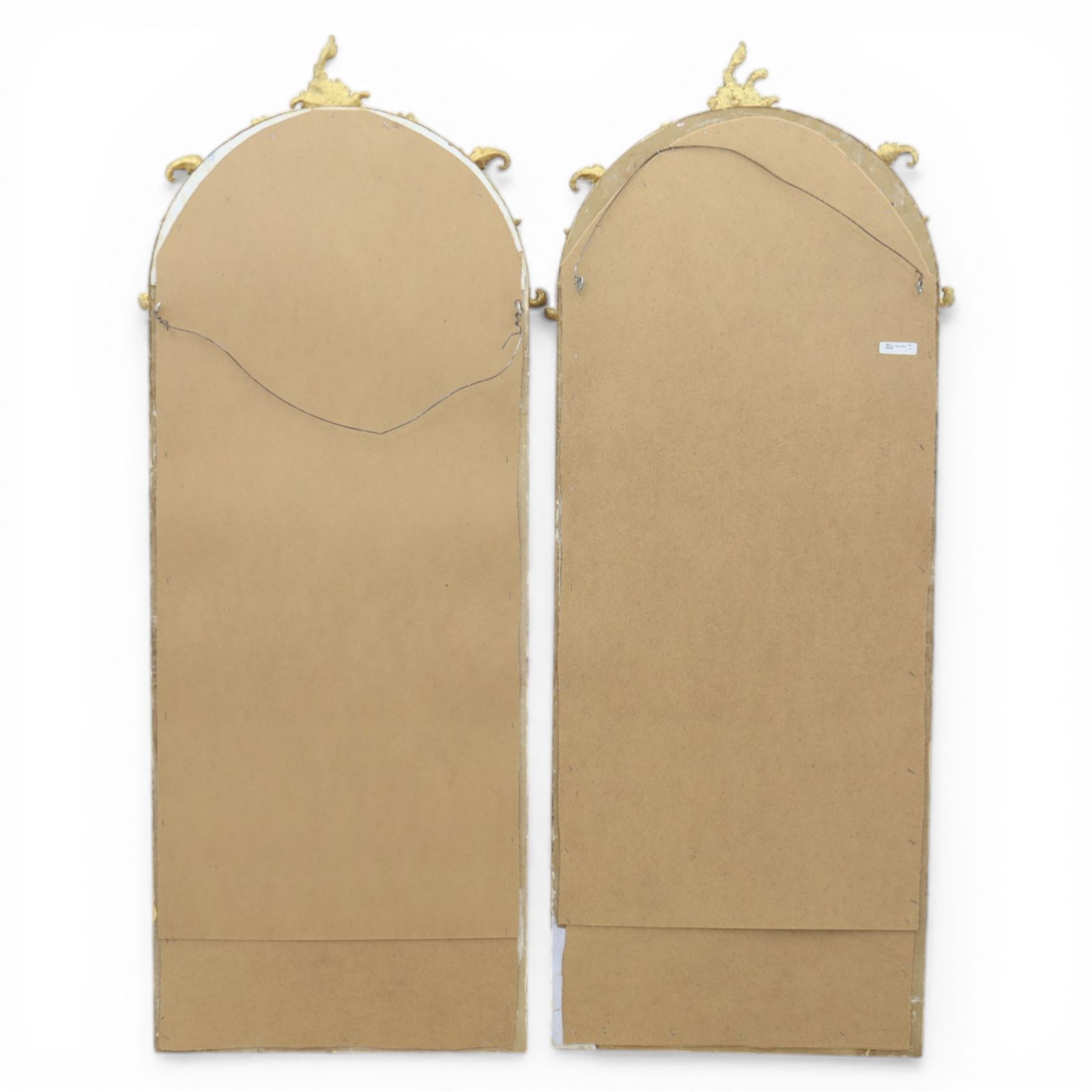 Pair of Louis XV style giltwood overmantel mirrors, the arched rectangular frame surmounted by an elaborate pierced cresting of acanthus scrolls, rocailles and floral swags, the moulded frame with continuous foliate carving and beaded inner slip