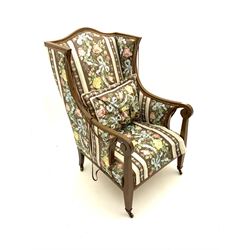 Edwardian inlaid and cross banded mahogany wingback armchair, upholstered in floral patterned 