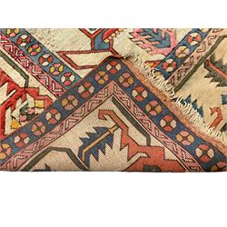 Anatolian Turkish ivory ground carpet, the central geometric pole medallion within an amber field, the guarded border decorated with stylised plant motifs surrounded by bands of repeating flower heads