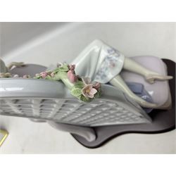 Lladro figure, Garden of Dreams, modelled as a woman reclining in front of trellis of flowers on a mahogany base, limited edition 3129/4000, sculpted by  José Puche, with original box, no 7634, year issued 1994, year retired 1996, H32cm