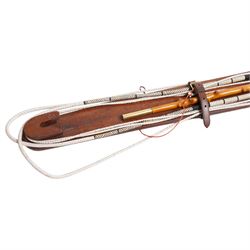 A Woodcock Hill - 20th century travelling coaching whip, the two part yew wood twisted shaft, with leather grip and brass collar and butt cap, with makers mark below the leather handle 'A Woodcock Hill Whip Maker G.I Clothier', together with an additional thong end, mounted upon a wall mounted holder, whip 142cm 