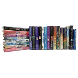 Collection of twenty-three hardback Terry Pratchett books, comprising approximately eighteen first editions including The Fifth Elephant signed & inscribed by Pratchett, all with dustjackets