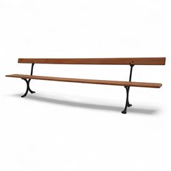 Pine garden bench, with stained and weatherproof varnish, single slat pine seat and back, raised on curved black cast iron supports