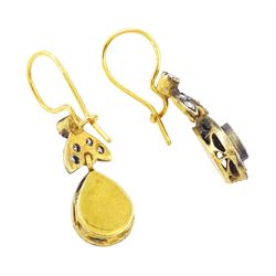 Pair of gold and silver diamond earrings, each pendant with pear shaped drop set with round brilliant cut and single cut diamonds, suspended from a diamond set leaf design bail, total diamond weight approx 1.00 carat