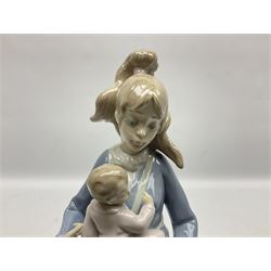 Three Lladro figures, comprising Modern Mother no 5873, Dropping the Flowers no 1285 and On the Beach no 1481, all with original boxes, largest example H30cm