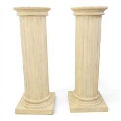 Pair of Regency style composite stone column pedestals, with fluted cylindrical columns an...