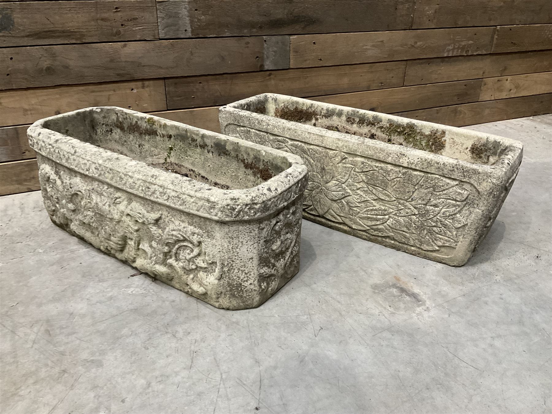 Ornate cast stone rectangular garden planter, lion mask and swag detail, and s similar planter (2)