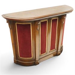 Arts & Crafts oak D-shaped bar, moulded edged counter above a front with velvet applied panels, the back with shelving, raised on a plinth base