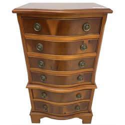 Georgian design small yew wood serpentine chest-on-chest, fitted with six cock-beaded drawers, lower moulded edge over bracket feet