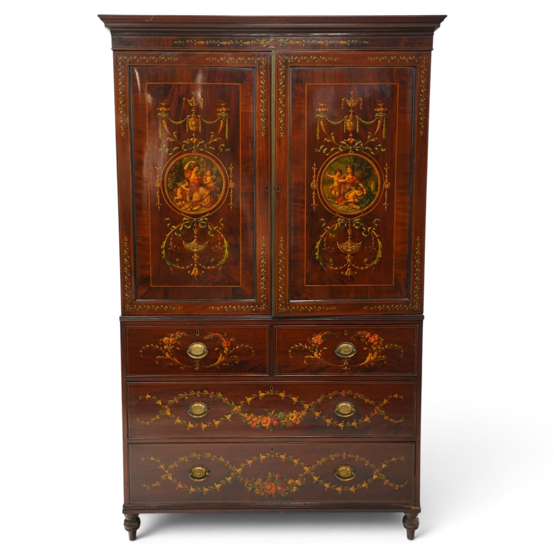 19th century French Louis XVI design mahogany and polychrome painted gentleman's press wardrobe - projecting cavetto cornice with urn and bellflower painted frieze, the twin doors with classical figural medallions surmounted by urns and festoon decoration with scrolling acanthus leaves, enclosing five sliding trays, the base fitted with two short over three long cock-beaded drawers, the facias painted with interlocking swags and garlands of bouquets with recumbent lion brass handle-plates, lower reeded edge on turned feet