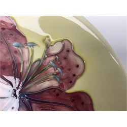 Moorcroft Tiger Lily pattern plate on a yellow ground, with painted and impressed mark beneath, D26cm