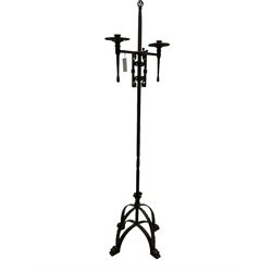 Ironwork candle holder stand, with stamped decoration, adjustable two branch sconces with scrolled iron work, twist stem with arched supports with scrolled terminals