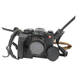Leica R-E camera body serial no. 1752690, in black finish, with a Leitz Summicron-R 1:2/50 E55 lens serial no. 3480570, with Leica GMBH motor winder R serial no. 61596