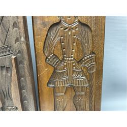 Six 20th century hardwood Dutch folk art Speculaasplank or biscuit moulds, typically carved with figures in traditional dress, largest H101cm