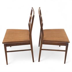 Richard Hornby for Fyne Ladye - mid-20th century afromosia teak dining table, tapered rectangular top with fluted edge and recess for spare leaf, raised on slender legs, four teak framed chairs, of ladder back design, with drop-in seat, upholstered seat, with tapered front legs and slightly raked rear legs,, table unextended width 106cm depth 79cm height 74cm with additional leaf 45cm wide- chairs width 48cm depth 41cm height 87cm 