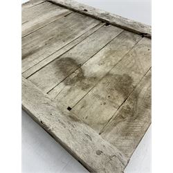 Rustic hardwood 'door' coffee table, wrought iron scrollwork base