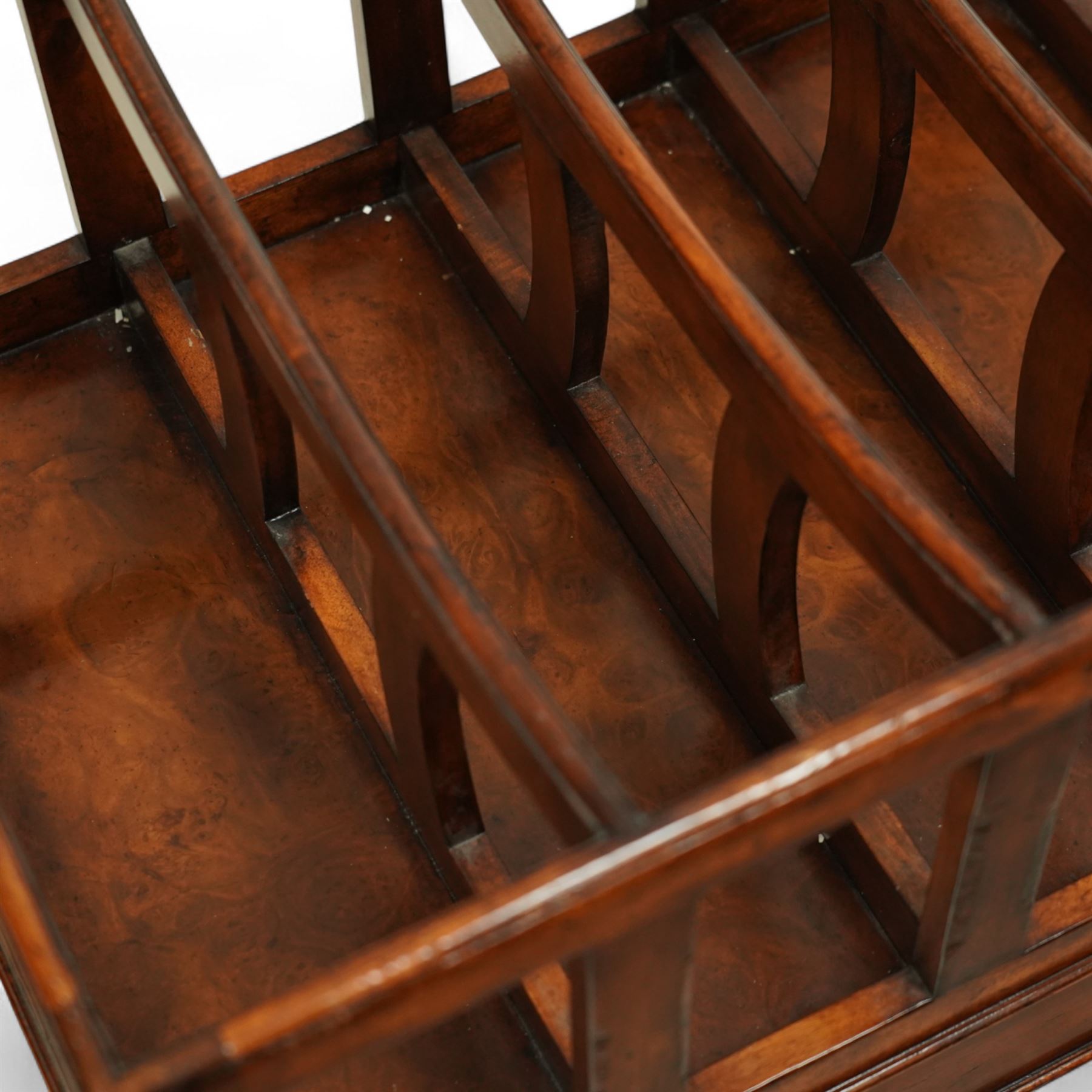Late 20th century large mahogany canterbury, of rectangular form with four divided curved upper racks, single frieze drawer with brass knob handles, raised on turned legs with brass castors