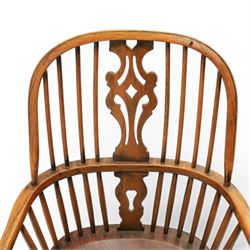 Pair of high back Windsor armchairs, fleur de lis back splat, dished seat, caroline stretcher