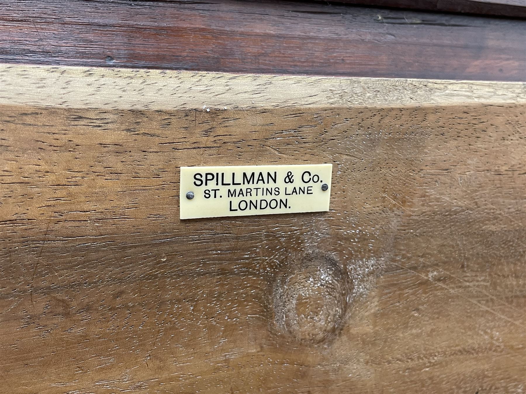 19th century camphor wood and mahogany silver chest, the hinged banded top with circular brass mounts which secure the interior strap hinges, fretwork metal strapping to the corners, on stand with plain frieze and acanthus carved cabriole ball and claw feet