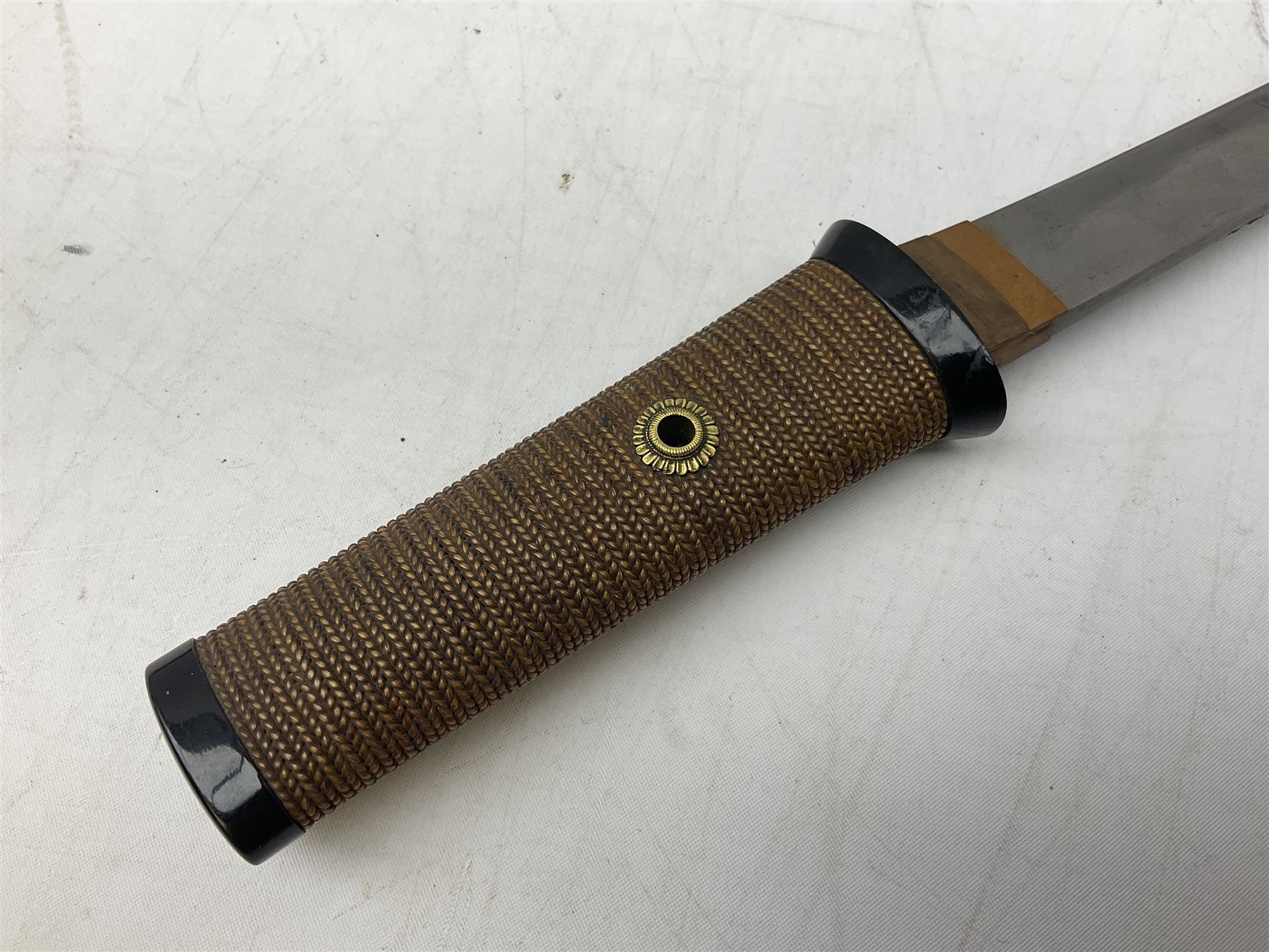 Japanese Tanto with 28.5cm steel blade and cord bound grip; in red spotted black lacquer saya containing a kogai knife with etched characters to the blade and ornate fern leaf and snake handle