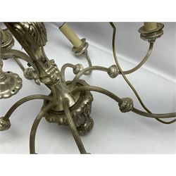 Siz branch silvered chandelier, decorated with acanthus leaves and putti, together with two matching three branch wall sconces, chandelier D65cm